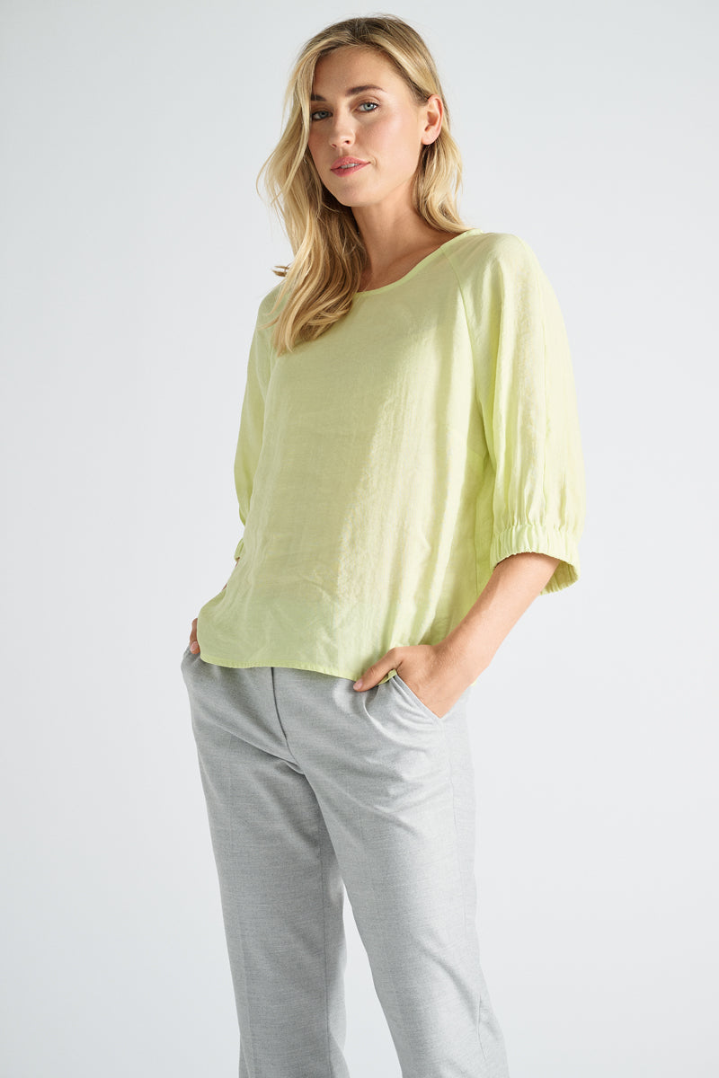 Lime-colored blouse with three-quarter sleeves and elasticated finish