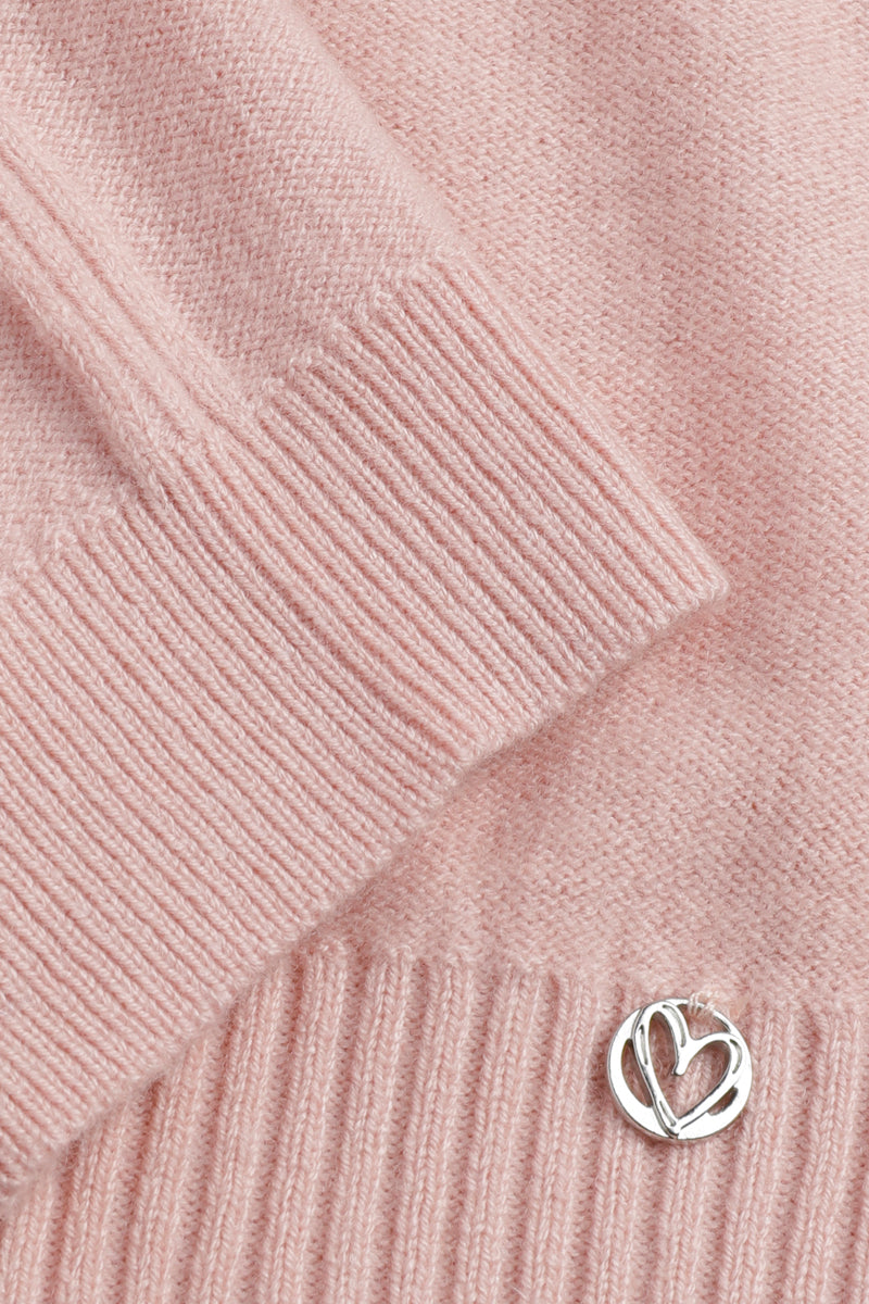 Pull rose clair avec col bateau