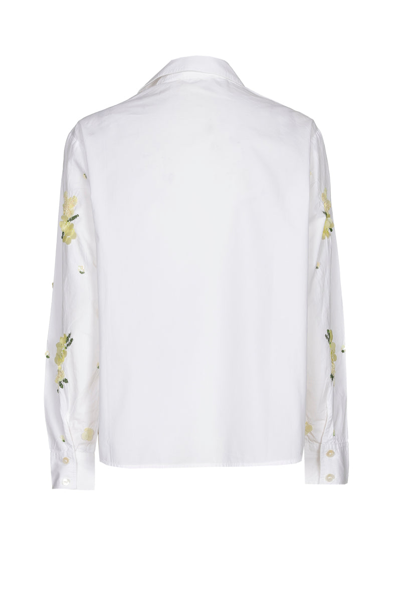 Chemisier blanc à paillettes jaunes