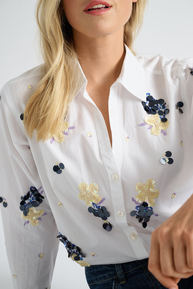Chemisier blanc à paillettes bleues