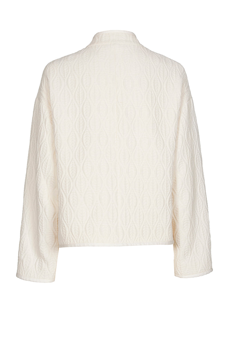 Veste courte couleur crème avec broderie ton sur ton